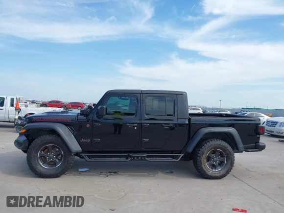 2021 Jeep Gladiator Rubicon z VIN 1C6JJTBG6ML535939, wystawiony jako IAAI lot #42260764 z przebiegiem 114 060 mil mil oraz . Historia ofert i sprzedaży dostępna na DreamBid. Obrazek 14.