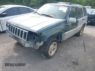1994 Jeep Grand Cherokee Laredo z VIN 1J4GZ58Y1RC265589, wystawiony jako IAAI lot #42142226 z przebiegiem 138 656 mil mil oraz . Historia ofert i sprzedaży dostępna na DreamBid. Obrazek 2.