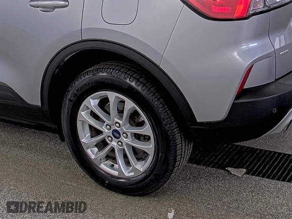 2022 Ford Escape SE z VIN 1FMCU9G66NUB33504, wystawiony jako IAAI lot #42748133 z przebiegiem 74 338 mil mil oraz . Historia ofert i sprzedaży dostępna na DreamBid. Obrazek 3.