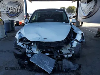2024 Tesla Model Y Long Range с VIN 7SAYGDEE0RF981488, выставлен на аукционе Copart как лот 58704135 с пробегом 21 417 миль миль и Списание • Salvage title. История ставок и продаж доступна на DreamBid. Изображение 5.
