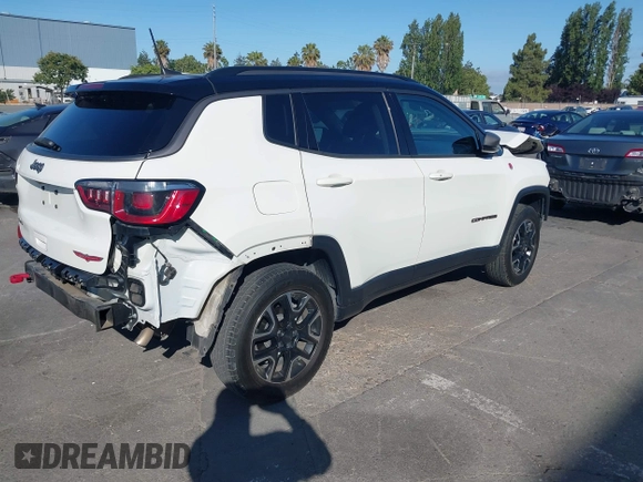 2020 Jeep Compass Trailhawk with VIN 3C4NJDDB4LT144129, listed as a IAAI auction lot 42582688 with 67,112 mi miles and . Bid and sale history available at DreamBid. Image 4.