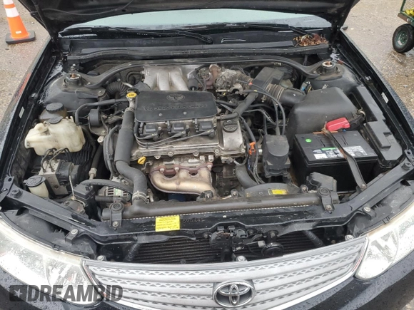 2002 Toyota Solara SE z VIN 2T1CF22P82C547530, wystawiony jako Copart lot #58586165 z przebiegiem 209 267 mil mil oraz Szkoda całkowita • Salvage title. Historia ofert i sprzedaży dostępna na DreamBid. Obrazek 11.