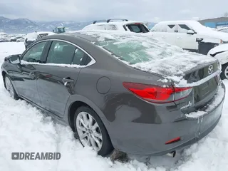 2016 Mazda Mazda6 i Touring with VIN JM1GJ1V58G1458699, listed as a IAAI auction lot 41598598 with 73,576 mi miles. Bid and sale history available at carsss.com. Image 3.