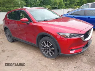 2018 Mazda CX-5 Grand Touring with VIN JM3KFBDM8J1407065, listed as a IAAI auction lot 42568546 with 99,178 mi miles and . Bid and sale history available at DreamBid. Image 1.
