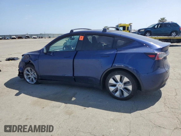 2023 Tesla Model Y Long Range with VIN 7SAYGAEE8PF927092, listed as a Copart auction lot 53917185 with 17,639 mi miles and Salvage Title. Bid and sale history available at DreamBid. Image 2.