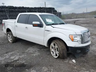 2011 Ford F-150 Lariat with VIN 1FTFW1E63BFB80098, listed as a IAAI auction lot 42038087 with 243,992 mi miles. Bid and sale history available at carsss.com. Image 1.