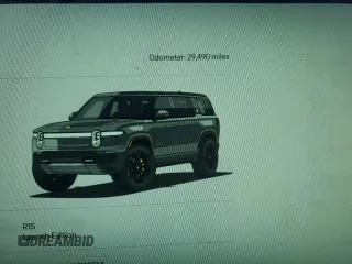 2022 Rivian R1S Launch Edition with VIN 7PDSGABL1NN000514, listed as a Copart auction lot 77444184 with 29,490 mi miles and Salvage Title. Bid and sale history available at DreamBid. Image 9.