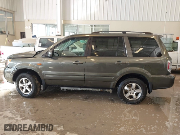 2006 Honda Pilot EX-L with VIN 5FNYF187X6B026463, listed as a IAAI auction lot 41612181 with 242,828 mi miles and . Bid and sale history available at DreamBid. Image 14.