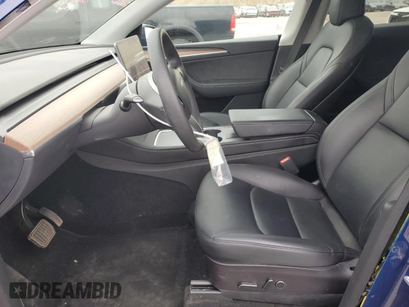 2023 Tesla Model Y Long Range with VIN 7SAYGAEE6PF689615, listed as a Copart auction lot 50999385 with 16,514 mi miles and Salvage Title. Bid and sale history available at DreamBid. Image 7.