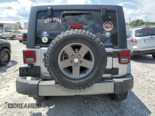 2013 Jeep Wrangler Unlimited Sport with VIN 1C4BJWDG4DL628518, listed as a Copart auction lot 65029795 with 142,852 mi miles and Salvage title. Bid and sale history available at DreamBid. Image 6.