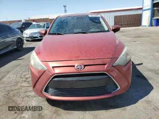 2016 Scion iA z VIN 3MYDLBZV3GY122064, wystawiony jako Copart lot #57616435 z przebiegiem 100 556 mil mil oraz Szkoda całkowita • Salvage title. Historia ofert i sprzedaży dostępna na DreamBid. Obrazek 5.