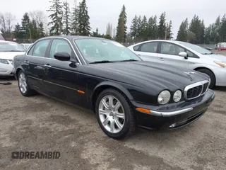 2004 Jaguar XJ with VIN SAJWA71C94SG29019, listed as a IAAI auction lot 41664978 with 133,546 mi miles. Bid and sale history available at carsss.com. Image 1.