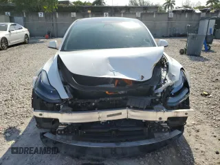 2023 Tesla Model 3 with VIN 5YJ3E1EA6PF510323, listed as a Copart auction lot 52094495 with 115,928 mi miles and Salvage Title. Bid and sale history available at DreamBid. Image 5.