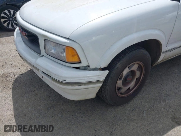 1997 GMC Sonoma z VIN 1GTCS1443VK511286, wystawiony jako IAAI lot #42236026 z przebiegiem 154 768 mil mil oraz . Historia ofert i sprzedaży dostępna na DreamBid. Obrazek 6.