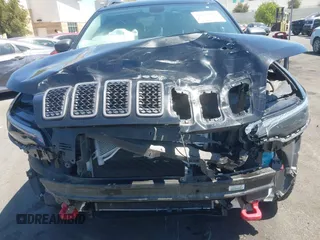 2019 Jeep Cherokee Trailhawk with VIN 1C4PJMBXXKD433284, listed as a IAAI auction lot 42020051 with 57,089 mi miles and . Bid and sale history available at DreamBid. Image 6.