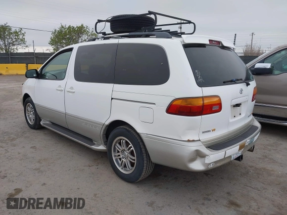 1999 Toyota Sienna LE with VIN 4T3ZF13C2XU105212, listed as a IAAI auction lot 42066557 with 153,659 mi miles. Bid and sale history available at carsss.com. Image 3.