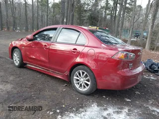 2016 Mitsubishi Lancer SE with VIN JA32V2FW7GU004159, listed as a IAAI auction lot 41401386 with 100,536 mi miles. Bid and sale history available at carsss.com. Image 3.