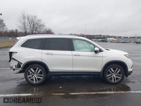 2016 Honda Pilot Touring with VIN 5FNYF6H95GB062089, listed as a IAAI auction lot 41810378 with 74,704 mi miles and . Bid and sale history available at DreamBid. Image 13.