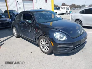 2017 Volkswagen Beetle 1.8T SE with VIN 3VWJ17ATXHM612411, listed as a IAAI auction lot 41900371 with 101,419 mi miles. Bid and sale history available at carsss.com. Image 1.