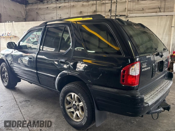 2002 Isuzu Rodeo S with VIN 4S2CK58W124336947, listed as a Copart auction lot 63482935 with 248,008 mi miles and Clean title. Bid and sale history available at DreamBid. Image 3.