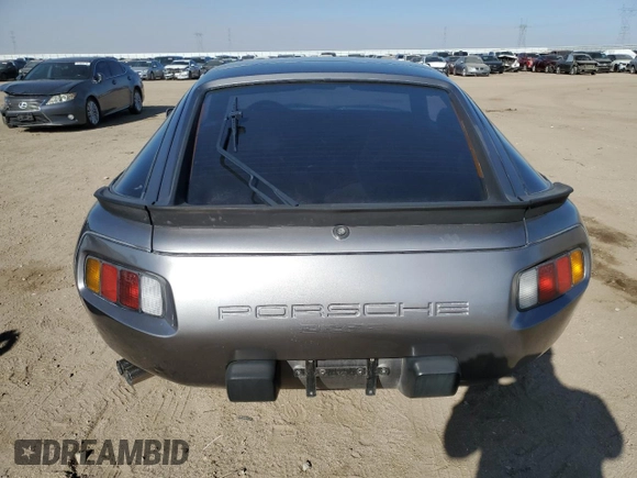1985 Porsche 928 z VIN WP0JB0927FS862258, wystawiony jako Copart lot #71369064 z przebiegiem 32 896 mil mil oraz Szkoda całkowita • Salvage title. Historia ofert i sprzedaży dostępna na DreamBid. Obrazek 6.