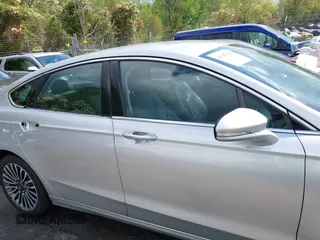 2017 Ford Fusion Titanium with VIN 3FA6P0K90HR266556, listed as a IAAI auction lot 41947924 with 135,628 mi miles. Bid and sale history available at carsss.com. Image 14.
