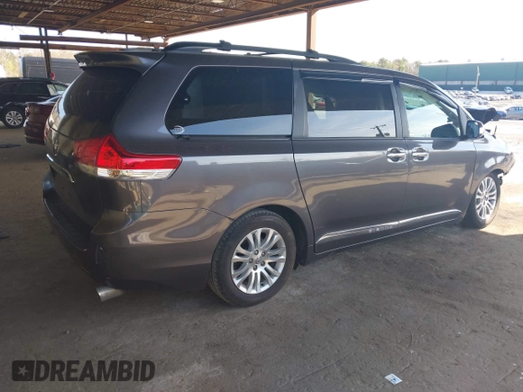 2014 Toyota Sienna XLE with VIN 5TDYK3DC5ES433949, listed as a IAAI auction lot 42095625 with 337,642 mi miles and . Bid and sale history available at DreamBid. Image 4.