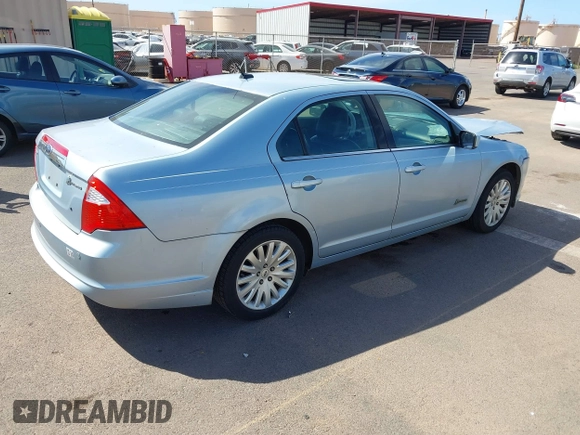 2010 Ford Fusion Hybrid z VIN 3FADP0L3XAR138980, wystawiony jako IAAI lot #41545161 z przebiegiem 92 386 mil mil oraz . Historia ofert i sprzedaży dostępna na DreamBid. Obrazek 4.