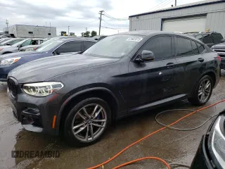 2021 BMW X4 M40i with VIN 5UX2V5C08M9E17162, listed as a Copart auction lot 67602073 with 33,879 mi miles. Bid and sale history available at carsss.com. Image 1.