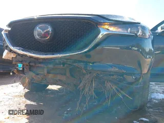 2020 Mazda CX-5 Touring z VIN JM3KFBCMXL1741182, wystawiony jako IAAI lot #41602315 z przebiegiem 31 582 mil mil oraz . Historia ofert i sprzedaży dostępna na DreamBid. Obrazek 6.