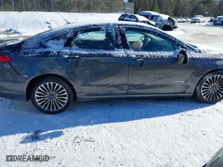 2018 Ford Fusion Hybrid Titanium with VIN 3FA6P0RU1JR101826, listed as a IAAI auction lot 41384334 with 69,039 mi miles. Bid and sale history available at carsss.com. Image 6.