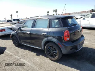 2016 MINI Countryman with VIN WMWZB3C58GWR47074, listed as a Copart auction lot 57174885 with 83,062 mi miles and Salvage title. Bid and sale history available at DreamBid. Image 2.
