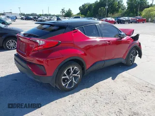 2020 Toyota C-HR LE with VIN JTNKHMBX3L1066720, listed as a IAAI auction lot 42042139 with 98,925 mi miles and . Bid and sale history available at DreamBid. Image 4.