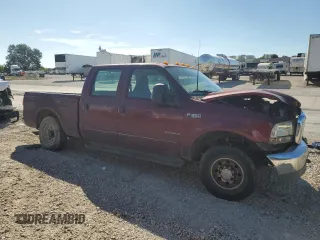 2000 Ford F-350 XL with VIN 1FTSW30F6YEB89796, listed as a Copart auction lot 67490144 with 517,242 mi miles and Salvage Title. Bid and sale history available at DreamBid. Image 4.