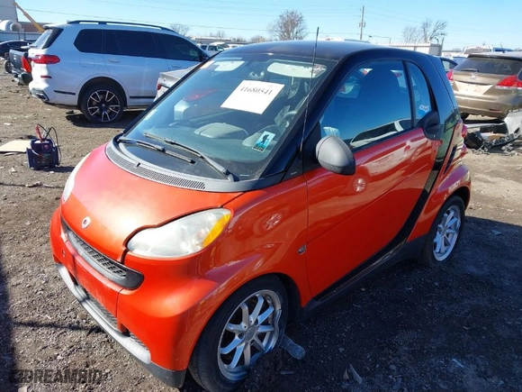 2008 Smart fortwo Pure with VIN WMEEJ31X28K122571, listed as a IAAI auction lot 41680541 with 63,673 mi miles. Bid and sale history available at carsss.com. Image 2.