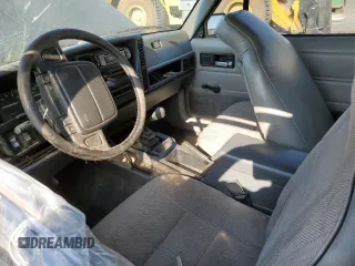 1995 Jeep Cherokee Sport with VIN 1J4FJ67S4SL519629, listed as a Copart auction lot 76107844 with 312,532 mi miles and Salvage Title. Bid and sale history available at carsss.com. Image 7.