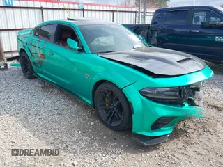 2021 Dodge Charger SRT Hellcat Widebody z VIN 2C3CDXL95MH623026, wystawiony jako IAAI lot #41421741 z przebiegiem 60 235 mil mil oraz . Historia ofert i sprzedaży dostępna na DreamBid. Obrazek 1.