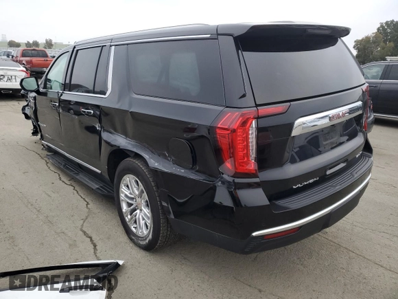 2023 GMC Yukon XL SLT with VIN 1GKS2GKD5PR363433, listed as a Copart auction lot 85979734 with 61,957 mi miles and Salvage Title. Bid and sale history available at DreamBid. Image 2.