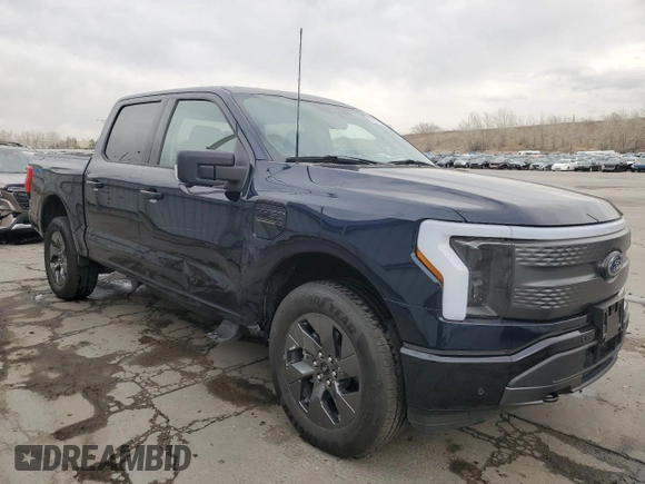 2023 Ford F-150 Lightning Pro with VIN 1FT6W1EV8PWG38071, listed as a Copart auction lot 51091495 with 13,687 mi miles and Salvage title. Bid and sale history available at DreamBid. Image 4.