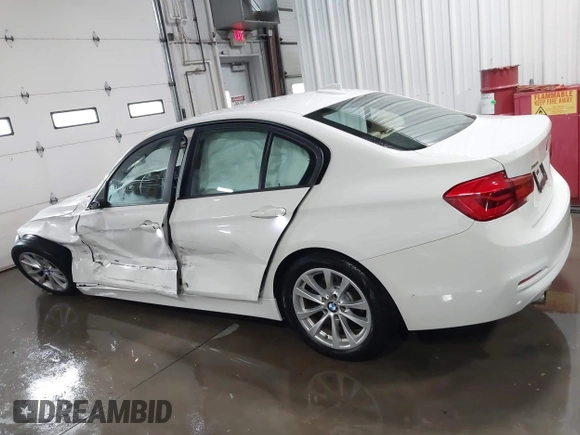 2018 BMW 3 Series 320i xDrive with VIN WBA8E5G56JNU47338, listed as a IAAI auction lot 41238204 with 54,596 mi miles. Bid and sale history available at carsss.com. Image 14.