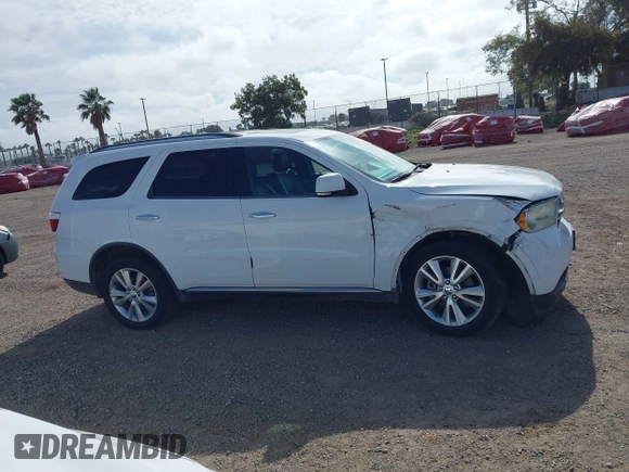 2013 Dodge Durango Crew with VIN 1C4SDHDT2DC679600, listed as a IAAI auction lot 42215737 with 128,499 mi miles and . Bid and sale history available at DreamBid. Image 13.