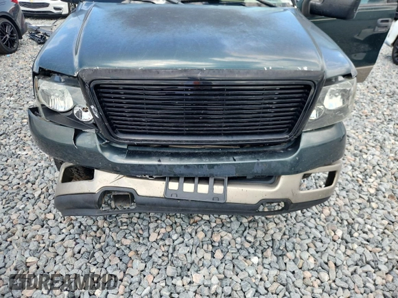 2004 Ford F-150 XL with VIN 1FTPX12564NA87792, listed as a Copart auction lot 60489655 with 396,269 mi miles and Salvage title. Bid and sale history available at DreamBid. Image 11.