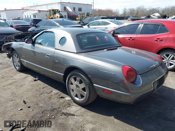 2003 Ford Thunderbird Deluxe z VIN 1FAHP60A23Y101899, wystawiony jako IAAI lot #41805269 z przebiegiem Nie podano mil oraz . Historia ofert i sprzedaży dostępna na DreamBid. Obrazek 3.