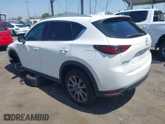 2020 Mazda CX-5 Grand Touring with VIN JM3KFADM9L0821930, listed as a IAAI auction lot 42549986 with 29,929 mi miles and . Bid and sale history available at DreamBid. Image 3.
