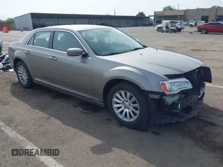 2014 Chrysler 300 with VIN 2C3CCAAG3EH322855, listed as a IAAI auction lot 42053129 with 172,687 mi miles. Bid and sale history available at carsss.com. Image 1.