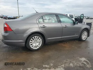 2012 Ford Fusion Hybrid z VIN 3FADP0L33CR211609, wystawiony jako Copart lot #60873005 z przebiegiem 144 474 mil mil oraz Szkoda całkowita • Salvage title. Historia ofert i sprzedaży dostępna na DreamBid. Obrazek 3.