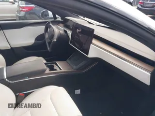 2021 Tesla Model S Long Range with VIN 5YJSA1E57MF428512, listed as a IAAI auction lot 42511020 with 29,611 mi miles and . Bid and sale history available at DreamBid. Image 5.
