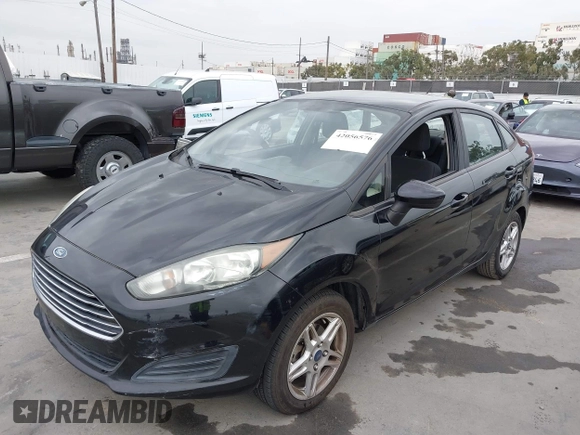 2017 Ford Fiesta SE z VIN 3FADP4BJ7HM145271, wystawiony jako IAAI lot #42056576 z przebiegiem 128 847 mil mil oraz . Historia ofert i sprzedaży dostępna na DreamBid. Obrazek 2.