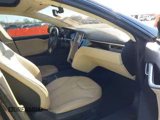 2014 Tesla Model S 60 with VIN 5YJSA1H17EFP33275, listed as a IAAI auction lot 41778167 with 202,749 mi miles and . Bid and sale history available at DreamBid. Image 5.