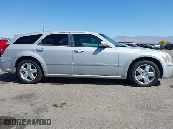 2005 Dodge Magnum z VIN 2D8GZ58235H576127, wystawiony jako IAAI lot #41989680 z przebiegiem 136 488 mil mil oraz . Historia ofert i sprzedaży dostępna na DreamBid. Obrazek 14.